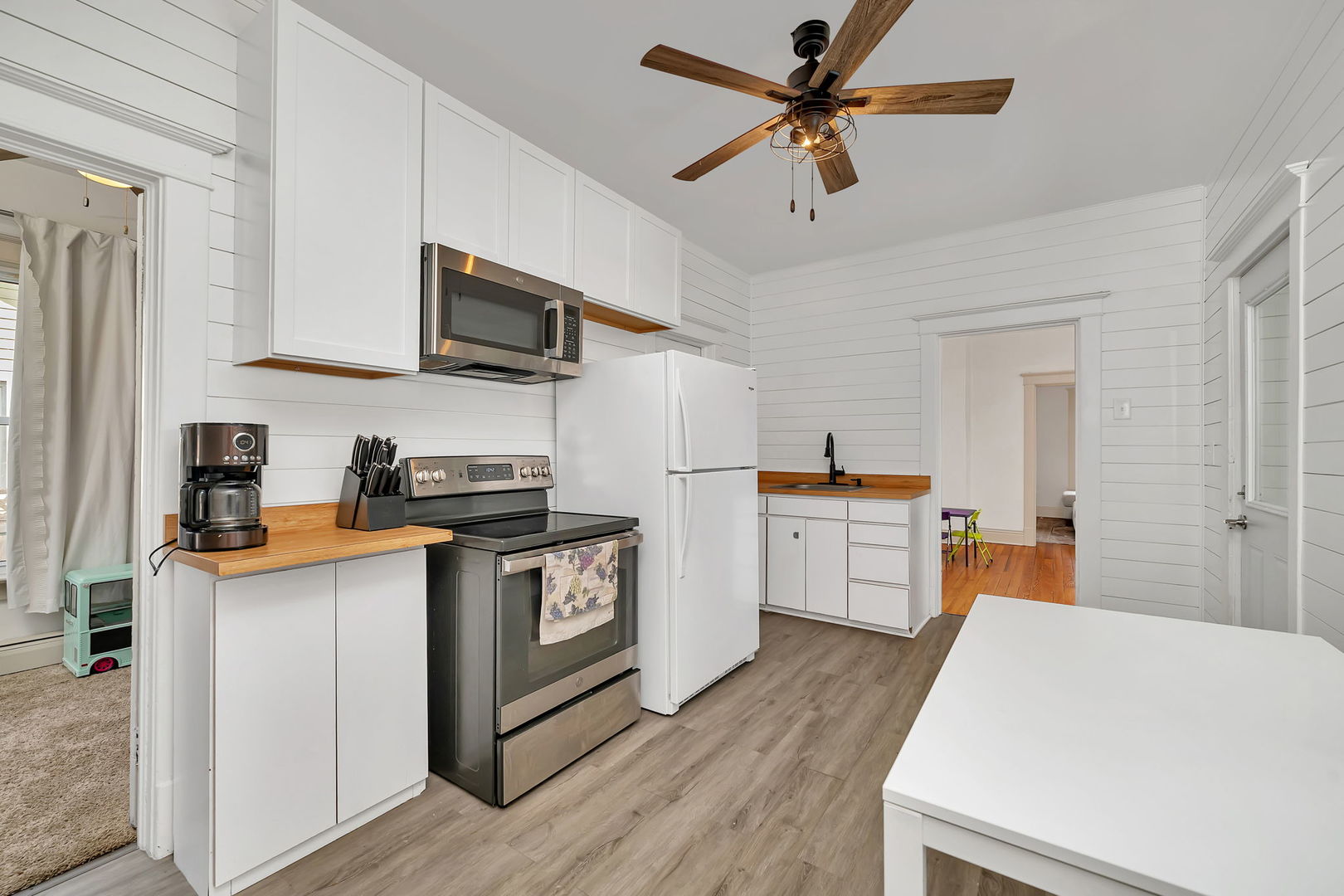 1122 Grant Street Morris, IL 60450 - Photo 17 of 25 a kitchen with white cabinets stainless steel appliances and sink