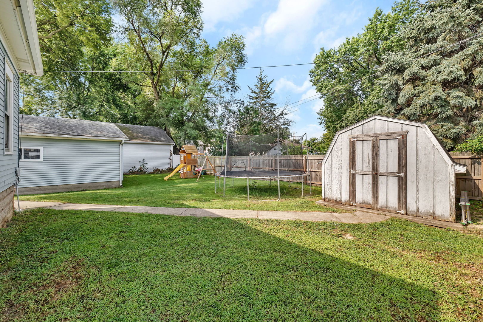 1122 Grant Street Morris, IL 60450 - Photo 25 of 25 a view of a backyard with a house and large trees