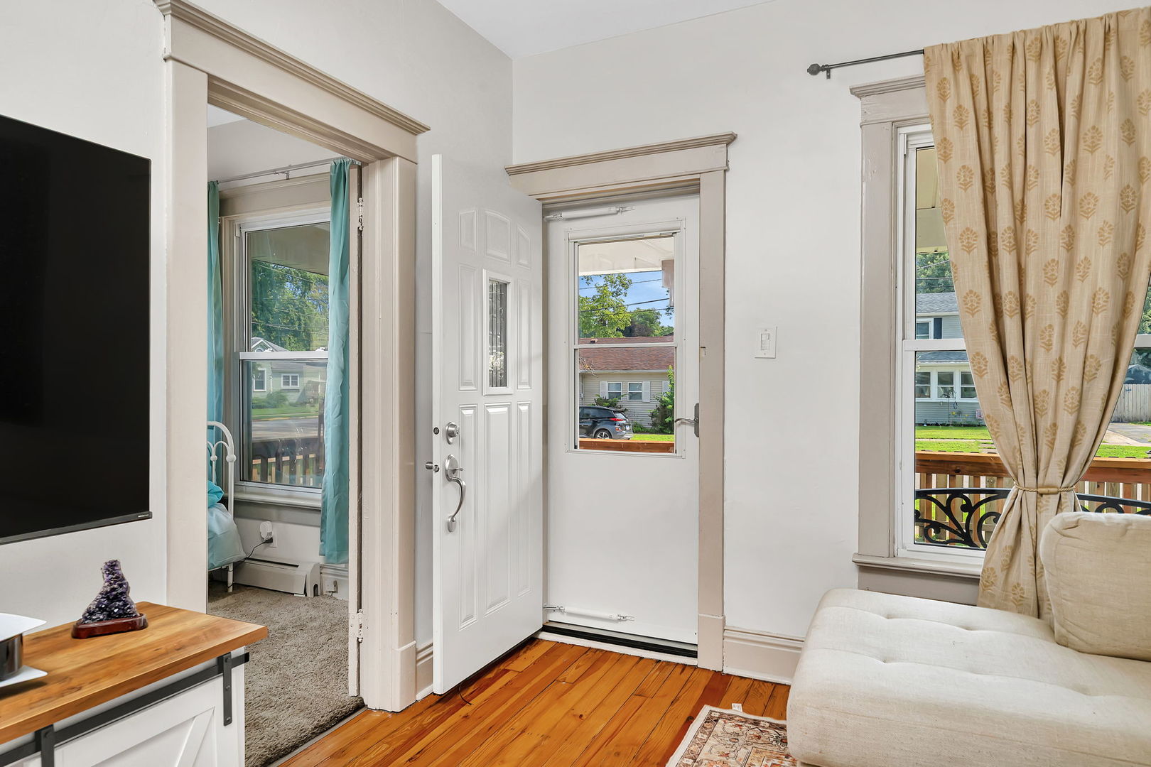 1122 Grant Street Morris, IL 60450 - Photo 4 of 25 a bedroom with a bed and a flat screen tv