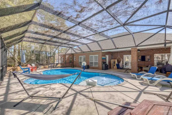 a view of a swimming pool with sitting area