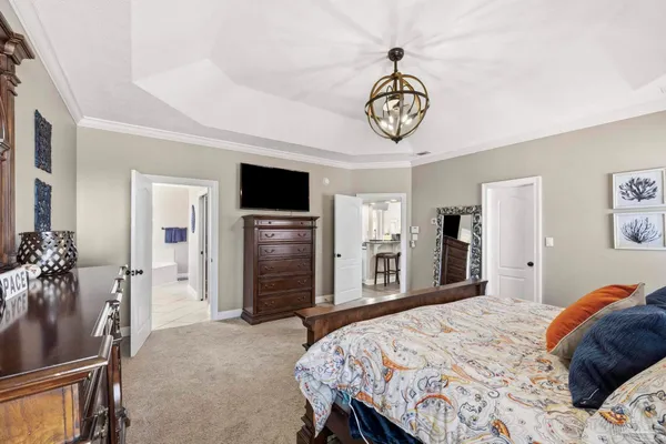 a bedroom with a bed and a television in it