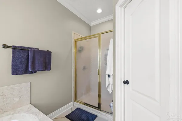 a bathroom with a shower and a mirror