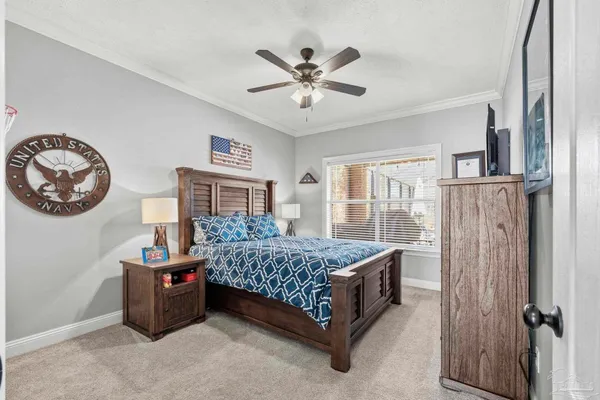 a bedroom with a bed and a table in it