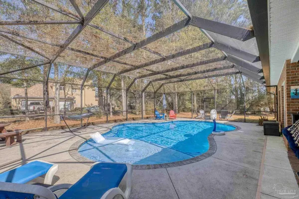 a view of a swimming pool with lounge chairs