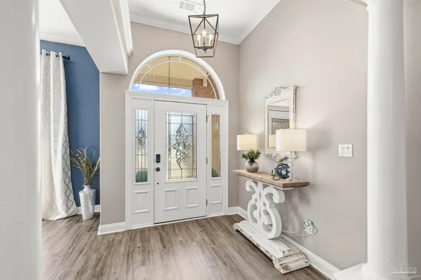 a view of an entryway with wooden floor