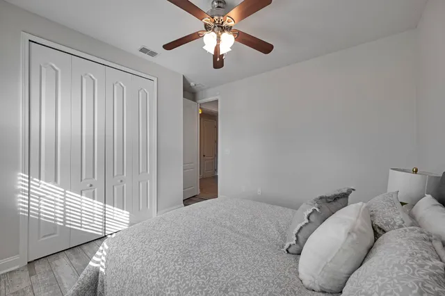 a bathroom with a sink vanity and mirror