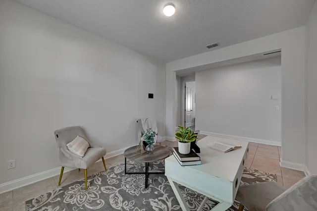 a bedroom with a bed and a ceiling fan