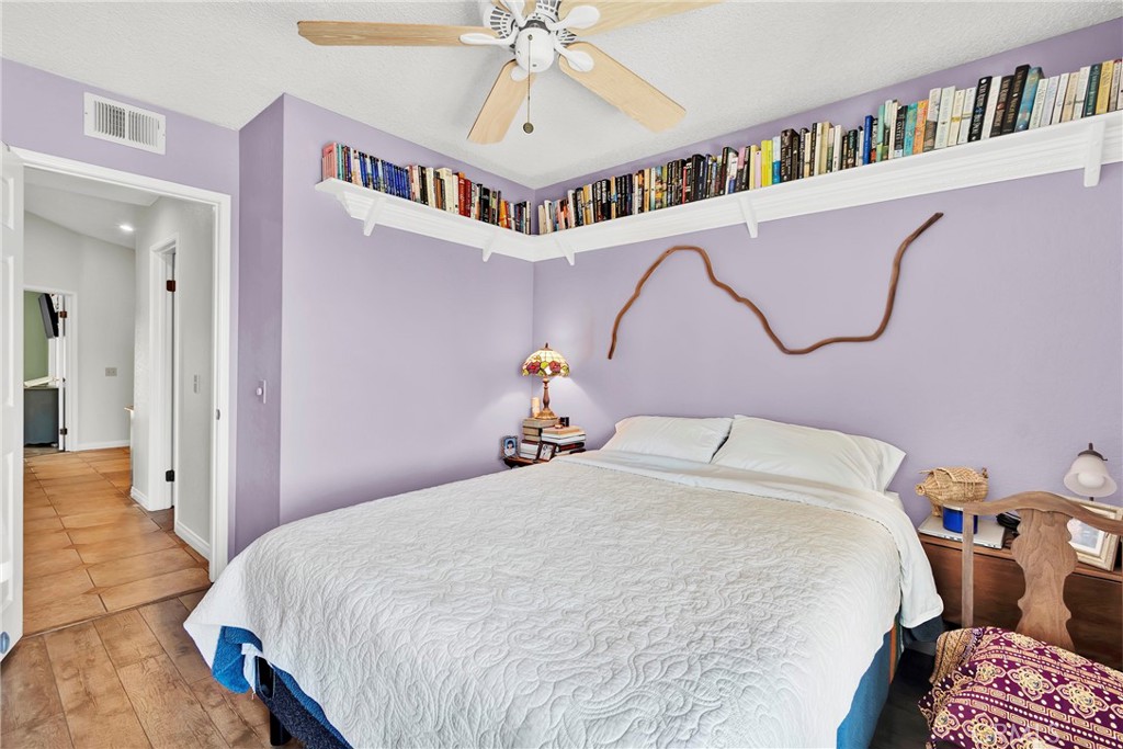 3350 May Court Riverside, CA 92503 - Photo 13 of 55 a bedroom with a bed and a book shelf