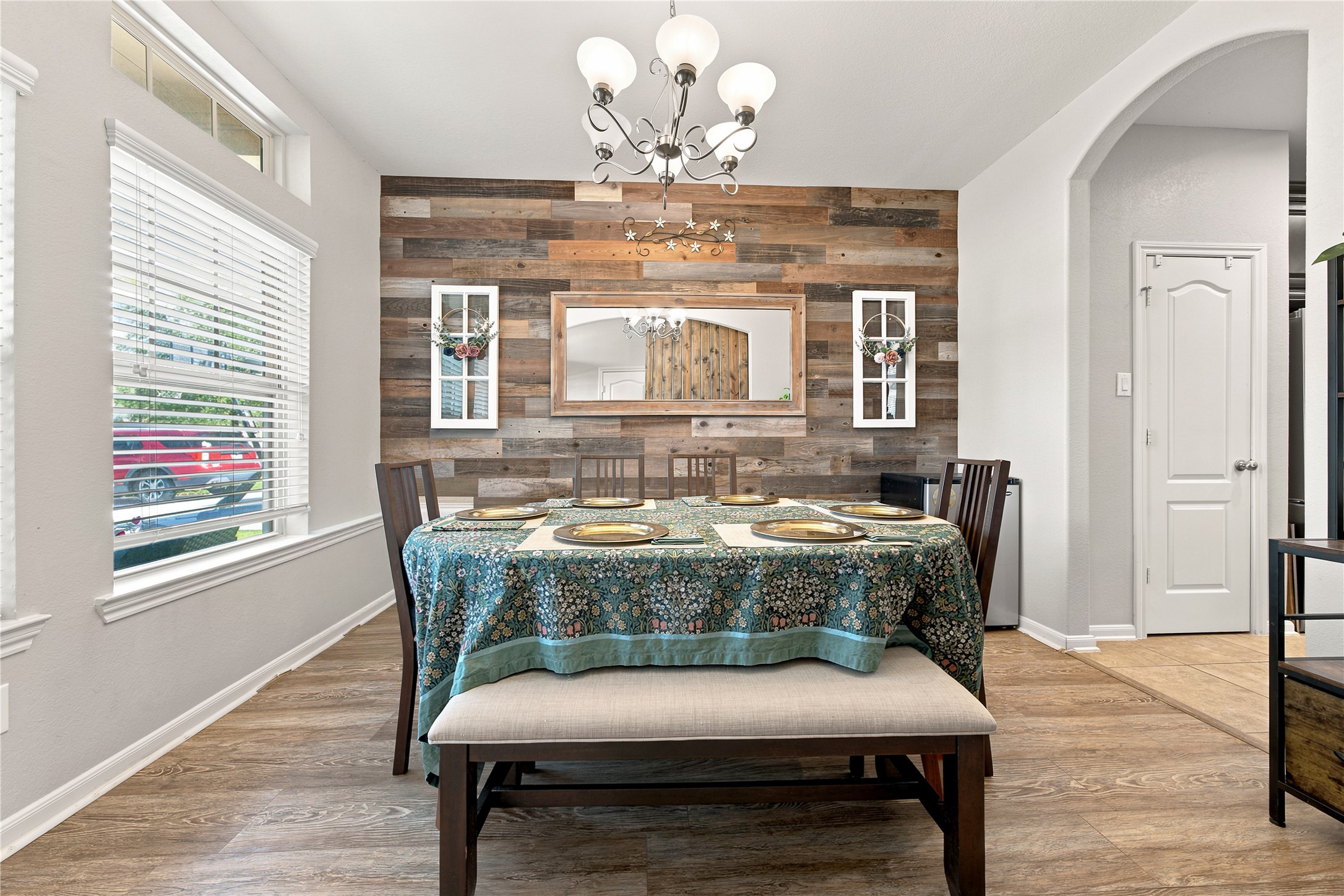234 Dale Ridge Lane Dickinson, TX 77539 - Photo 4 of 31 Formal dining room has a beautiful wood accent wall and arched entry into the kitchen.