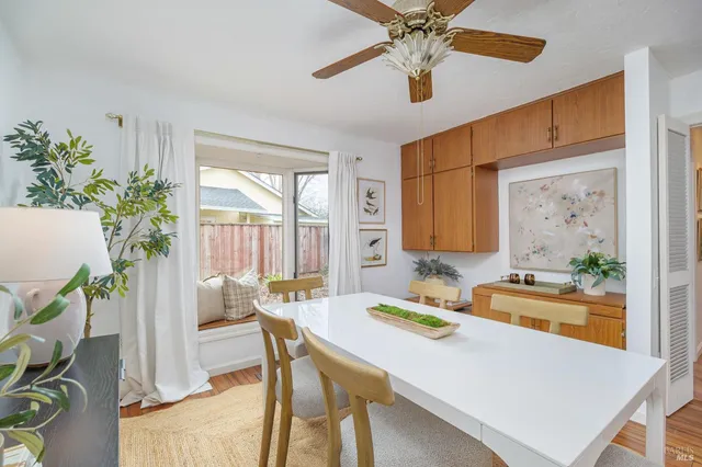 a dining room with furniture and window