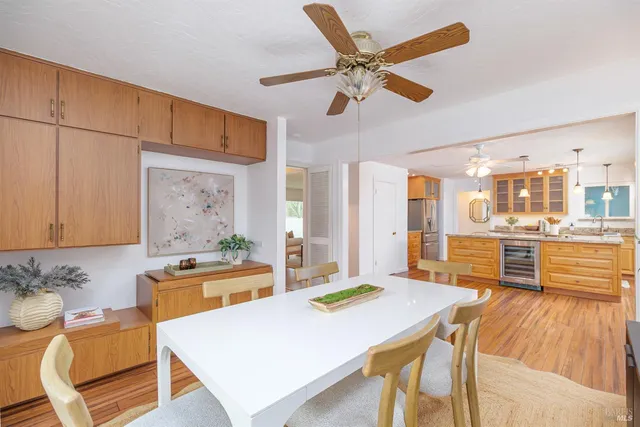 a living room with stainless steel appliances kitchen island granite countertop furniture and a kitchen view