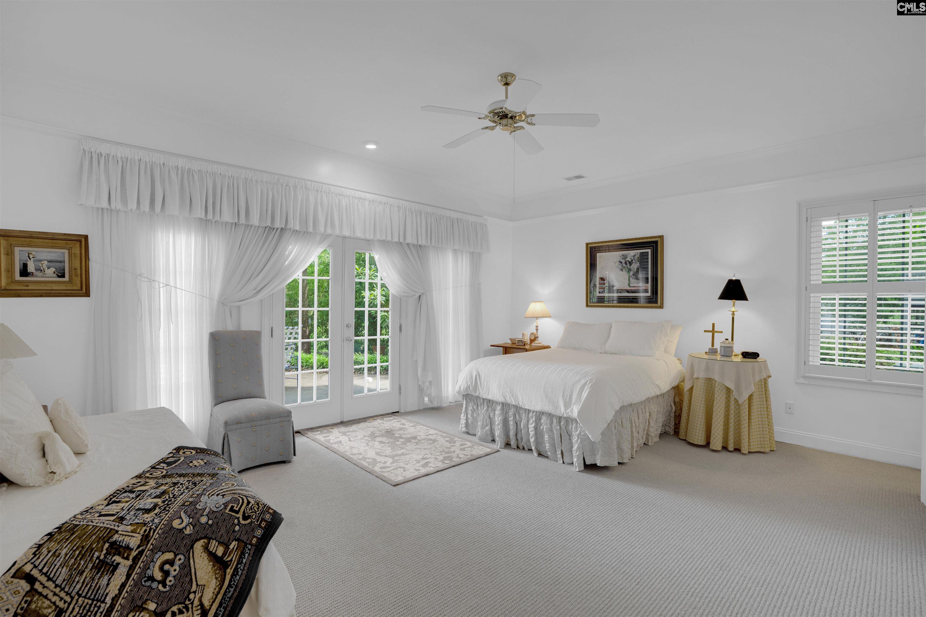 1101 Ellett Road Chapin, SC 29036 - Photo 16 of 24 a bedroom with a bed and a large window