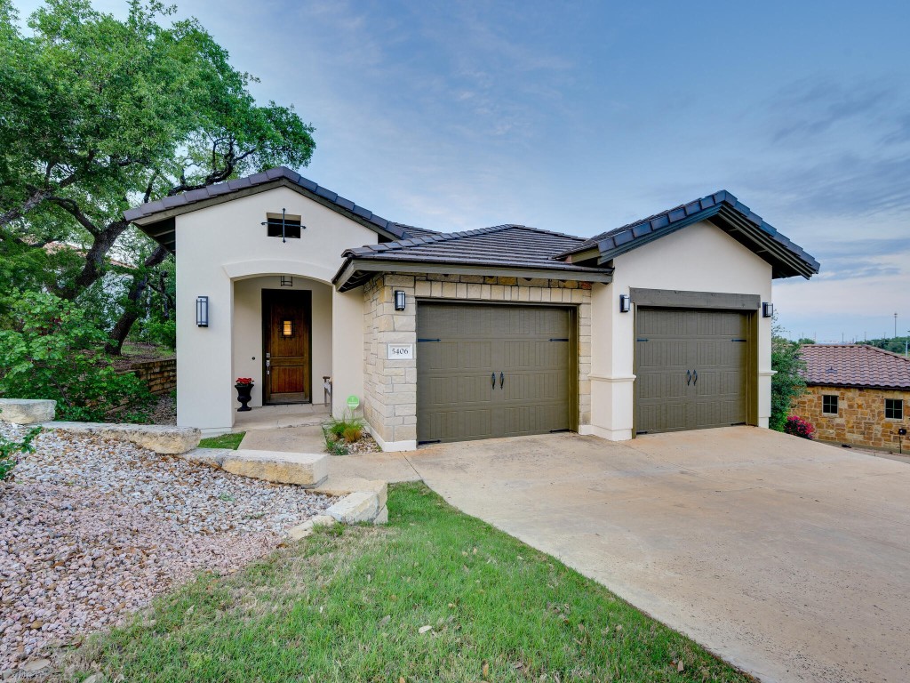 5406 Patagonia Pass Bee Cave, TX 78738 - Photo 1 of 1 a front view of a house with garden