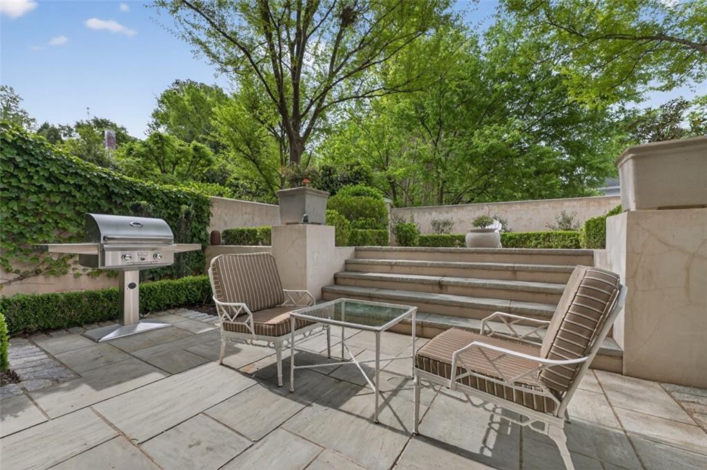 2288 Peachtree Road Northwest, Unit 4 Atlanta, GA 30309 - Photo 31 of 50 a view of a chairs and table in backyard of the house