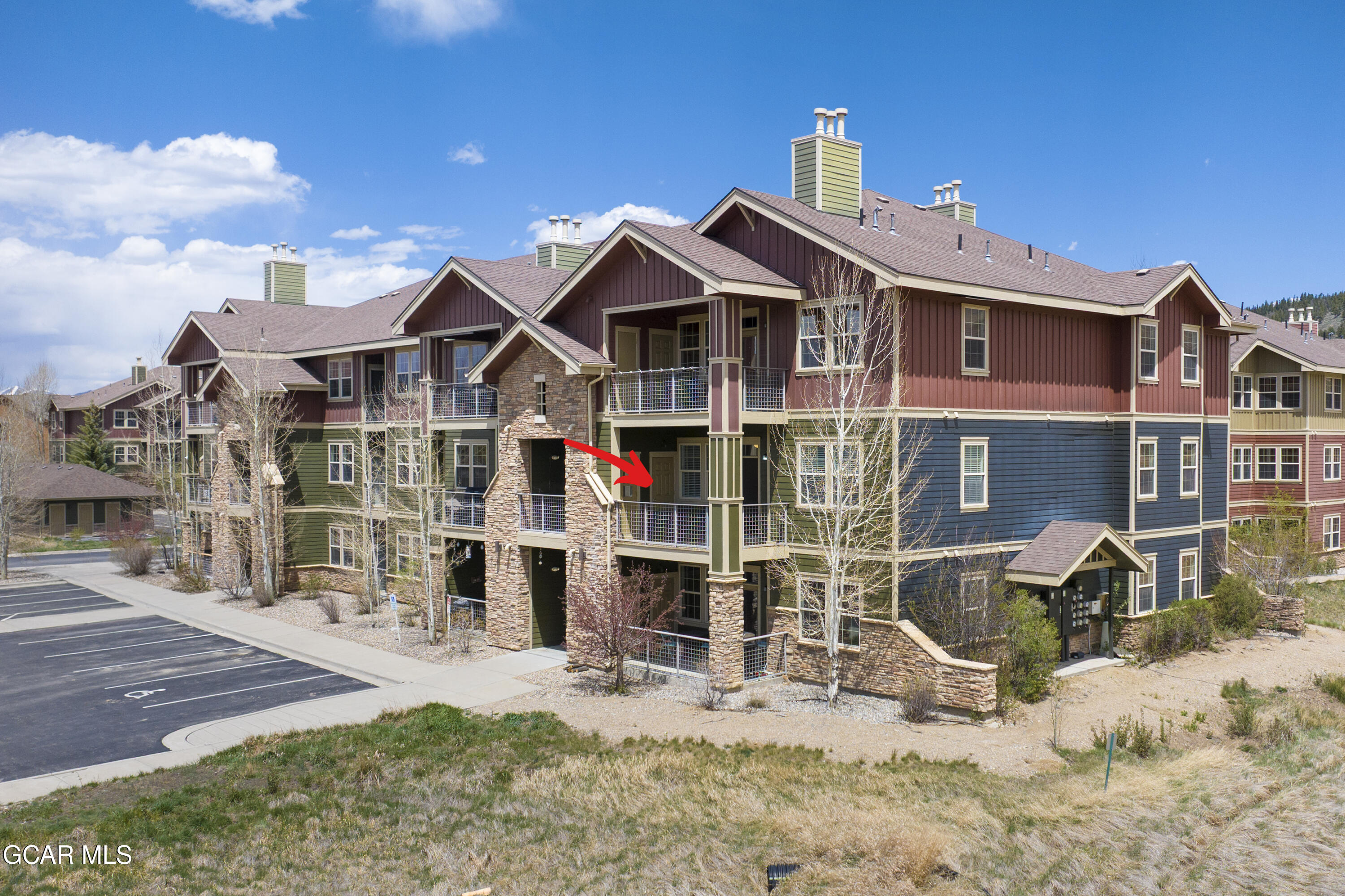 160 Village Road, Unit F207 Granby, CO 80446 - Photo 26 of 28 a front view of a house with a yard