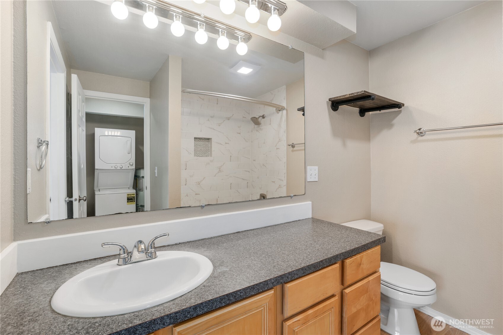 1010 North J Street, Unit 2 Tacoma, WA 98403 - Photo 12 of 29 a bathroom with a sink a toilet and shower