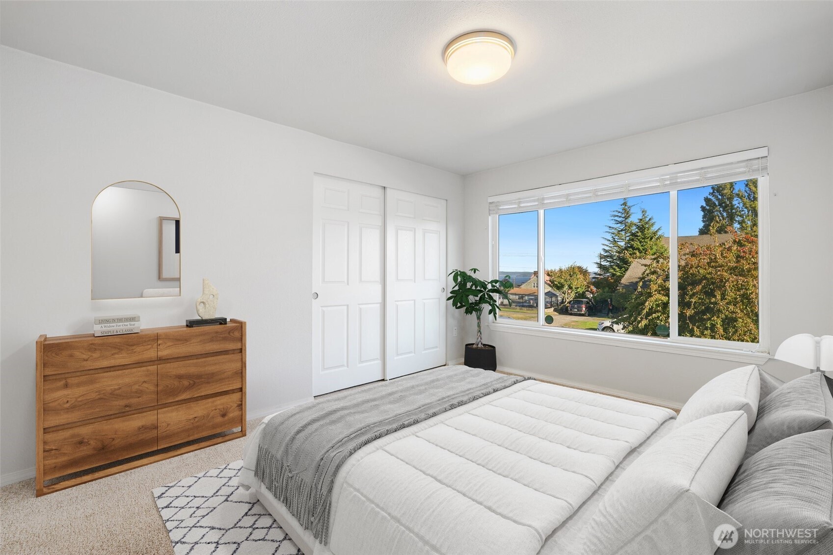 1010 North J Street, Unit 2 Tacoma, WA 98403 - Photo 13 of 29 a bedroom with a bed and a large window