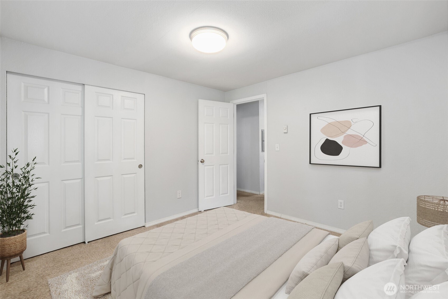 1010 North J Street, Unit 2 Tacoma, WA 98403 - Photo 17 of 29 a bedroom with a bed and a painting on the wall