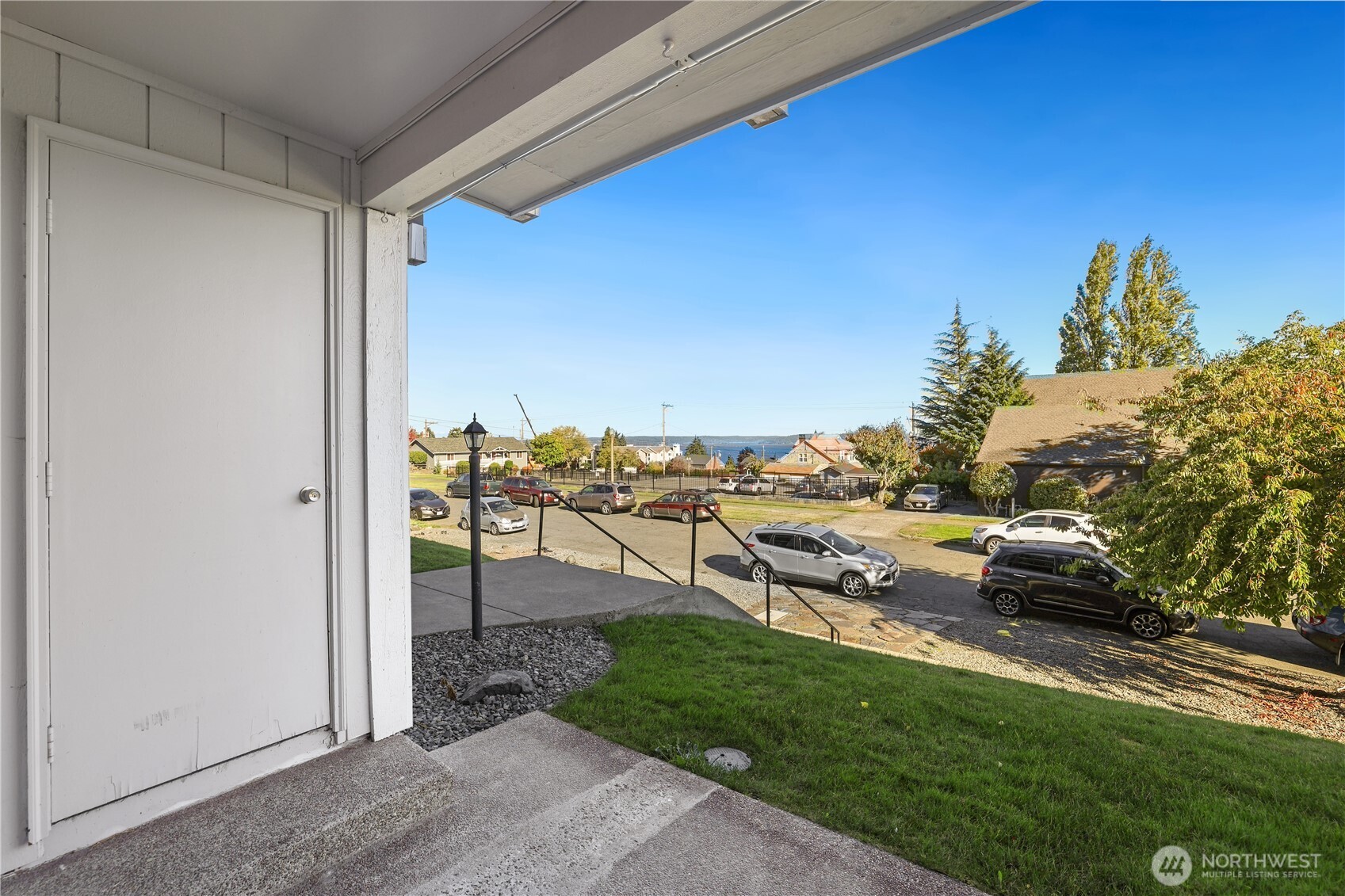 1010 North J Street, Unit 2 Tacoma, WA 98403 - Photo 19 of 29 a view of a terrace with a bench