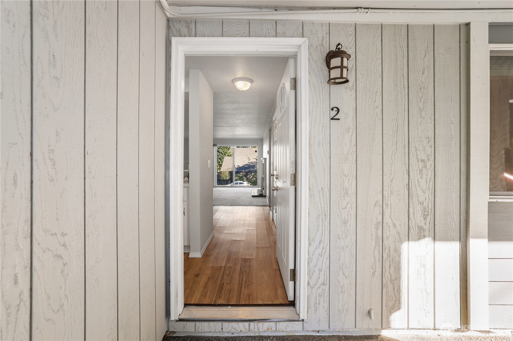 1010 North J Street, Unit 2 Tacoma, WA 98403 - Photo 3 of 29 a view of a livingroom from a hallway