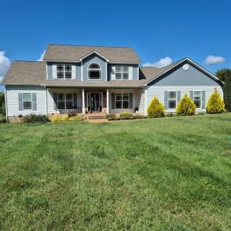 610 Rolling Meadows Lane Rickman, TN 38580 - Photo 1 of 42 a front view of a house with a garden