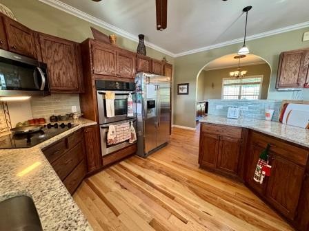 610 Rolling Meadows Lane Rickman, TN 38580 - Photo 17 of 42 a kitchen with stainless steel appliances granite countertop a stove a sink and a refrigerator