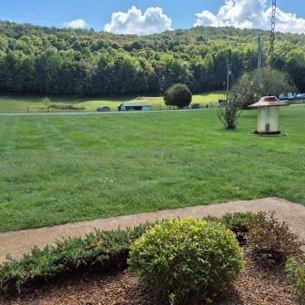 610 Rolling Meadows Lane Rickman, TN 38580 - Photo 2 of 42 a view of a garden with an outdoor seating