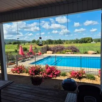 a front view of a house with a garden and outdoor seating
