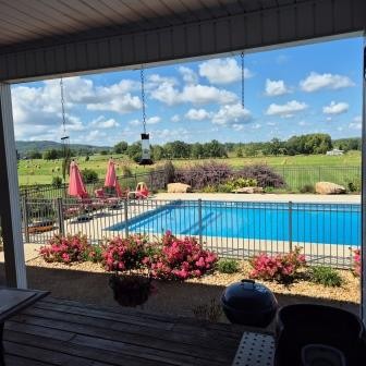 610 Rolling Meadows Lane Rickman, TN 38580 - Photo 3 of 42 a front view of a house with a garden and outdoor seating