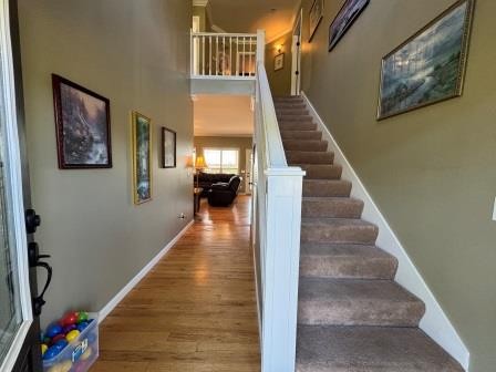 610 Rolling Meadows Lane Rickman, TN 38580 - Photo 5 of 42 a view of staircase with lots of frames on wall and a wooden floor