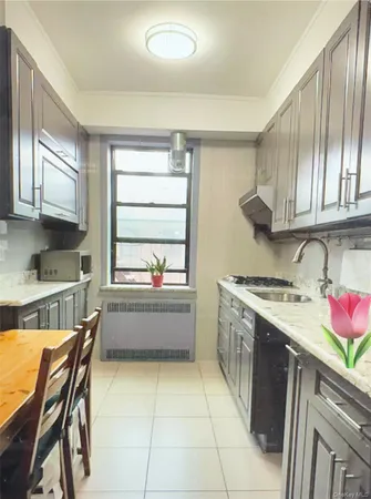 a kitchen with a stove a sink and a refrigerator