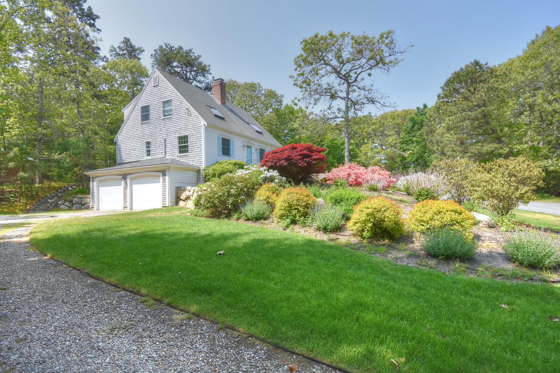 41 Turning Mill Road Brewster, MA 02631 - Photo 1 of 44 a view of a house with a big yard potted plants and large tree