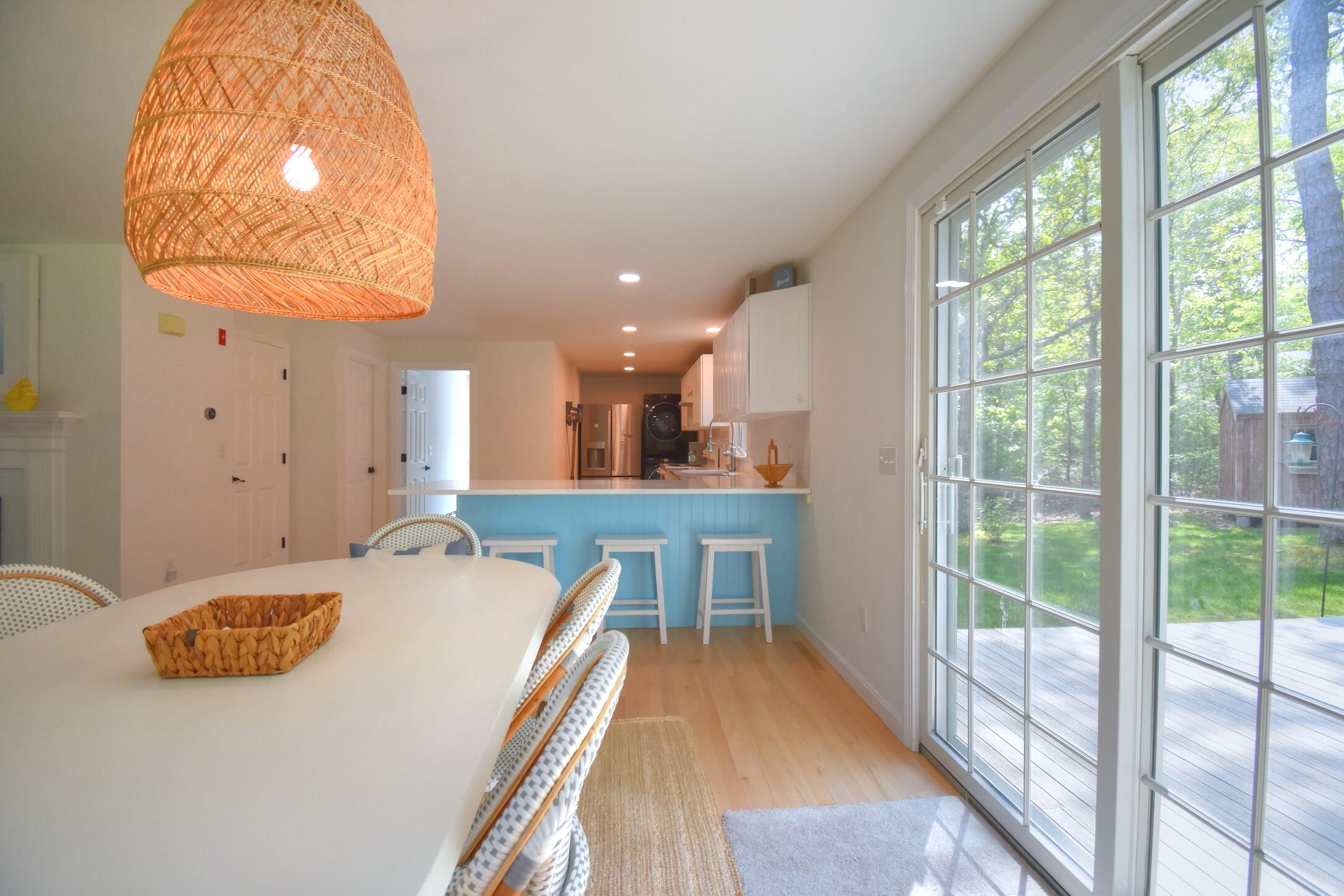 41 Turning Mill Road Brewster, MA 02631 - Photo 11 of 44 a dining room with a table and chairs