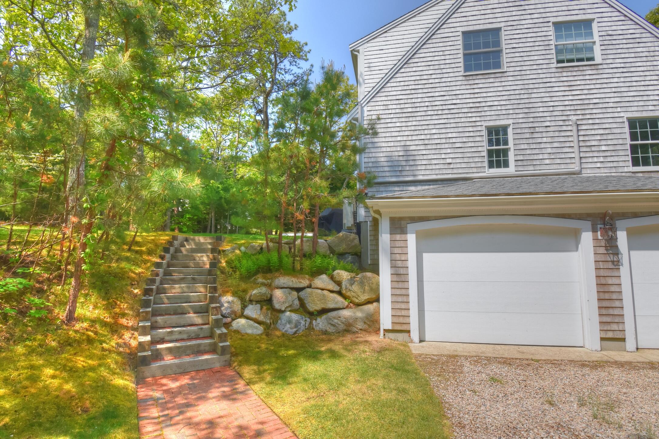 41 Turning Mill Road Brewster, MA 02631 - Photo 27 of 44 a front view of a house with a yard