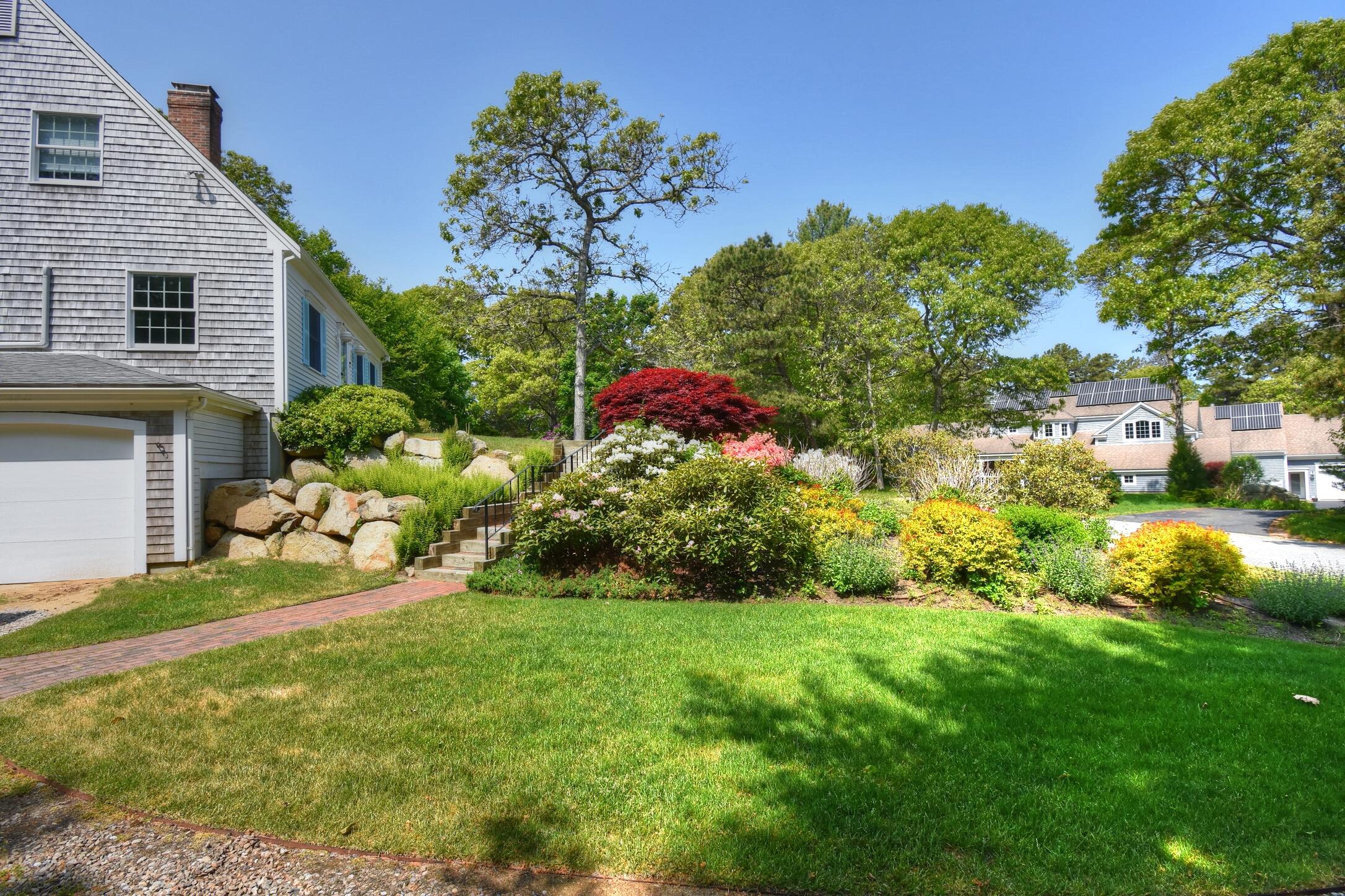 41 Turning Mill Road Brewster, MA 02631 - Photo 30 of 44 a front view of a house with a yard