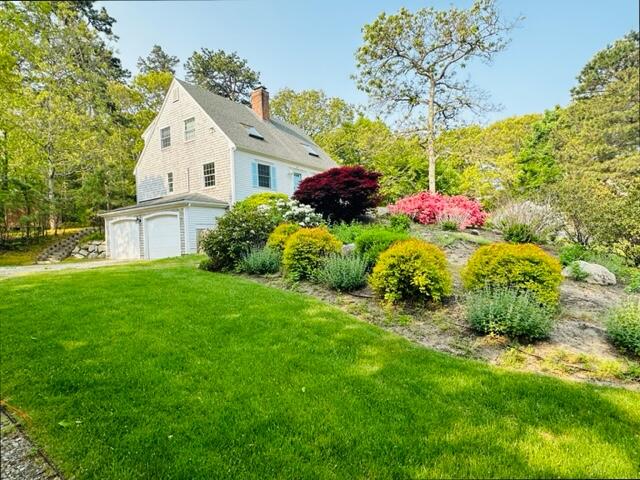 41 Turning Mill Road Brewster, MA 02631 - Photo 31 of 44 a view of a white house with a big yard and large trees