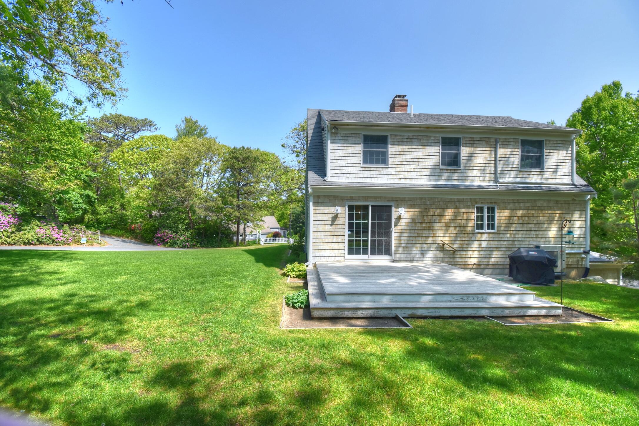 41 Turning Mill Road Brewster, MA 02631 - Photo 36 of 44 a front view of a house with a yard