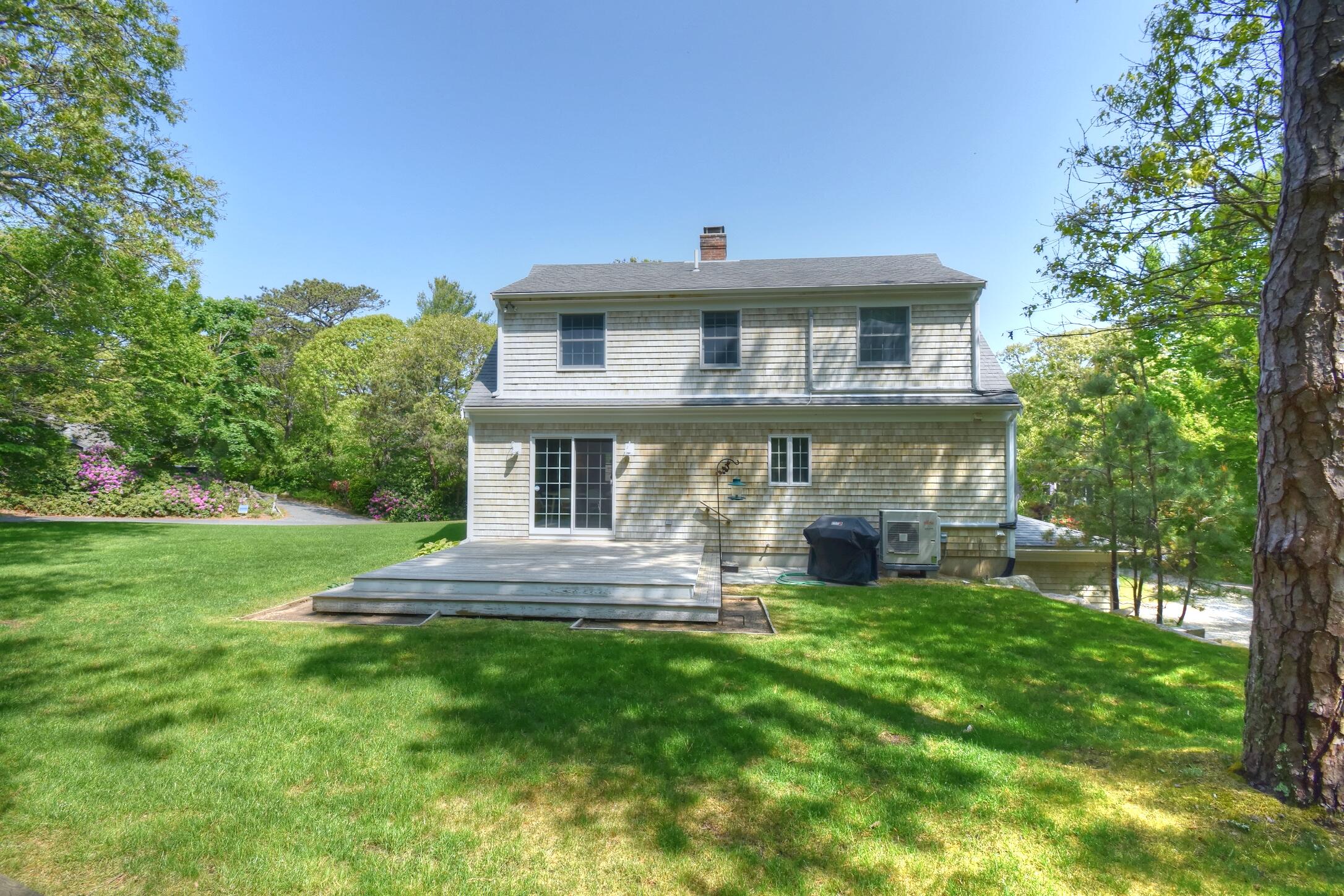 41 Turning Mill Road Brewster, MA 02631 - Photo 37 of 44 a front view of a house with a yard