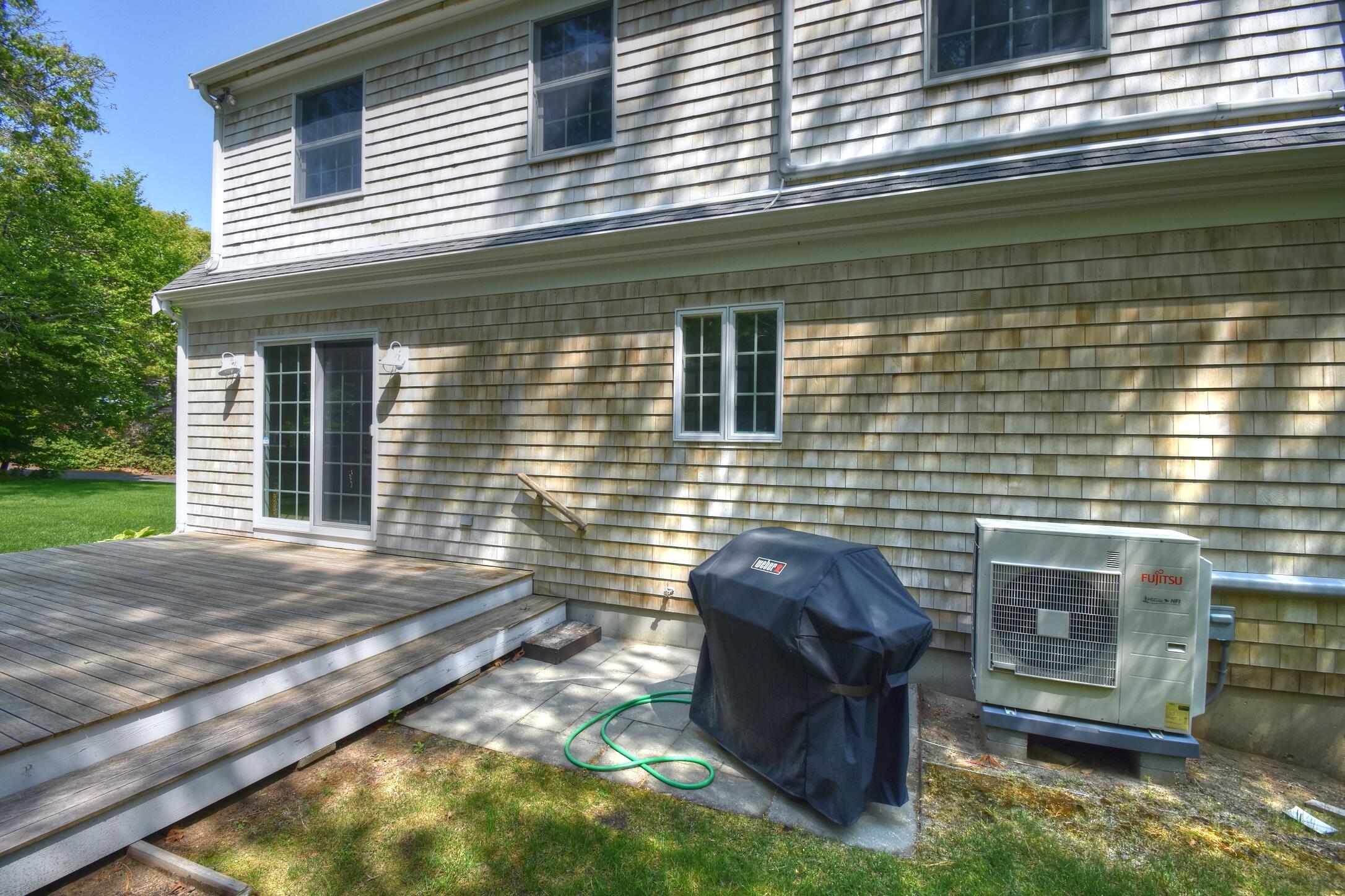 41 Turning Mill Road Brewster, MA 02631 - Photo 38 of 44 a view of a backyard with plants and outdoor seating