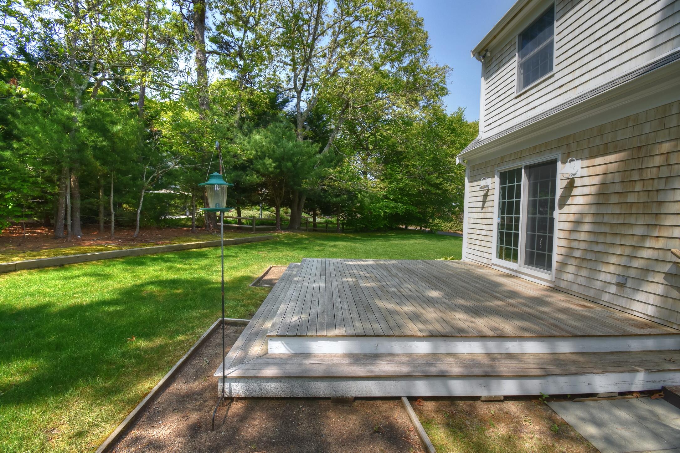 41 Turning Mill Road Brewster, MA 02631 - Photo 39 of 44 a view of a backyard with a garden