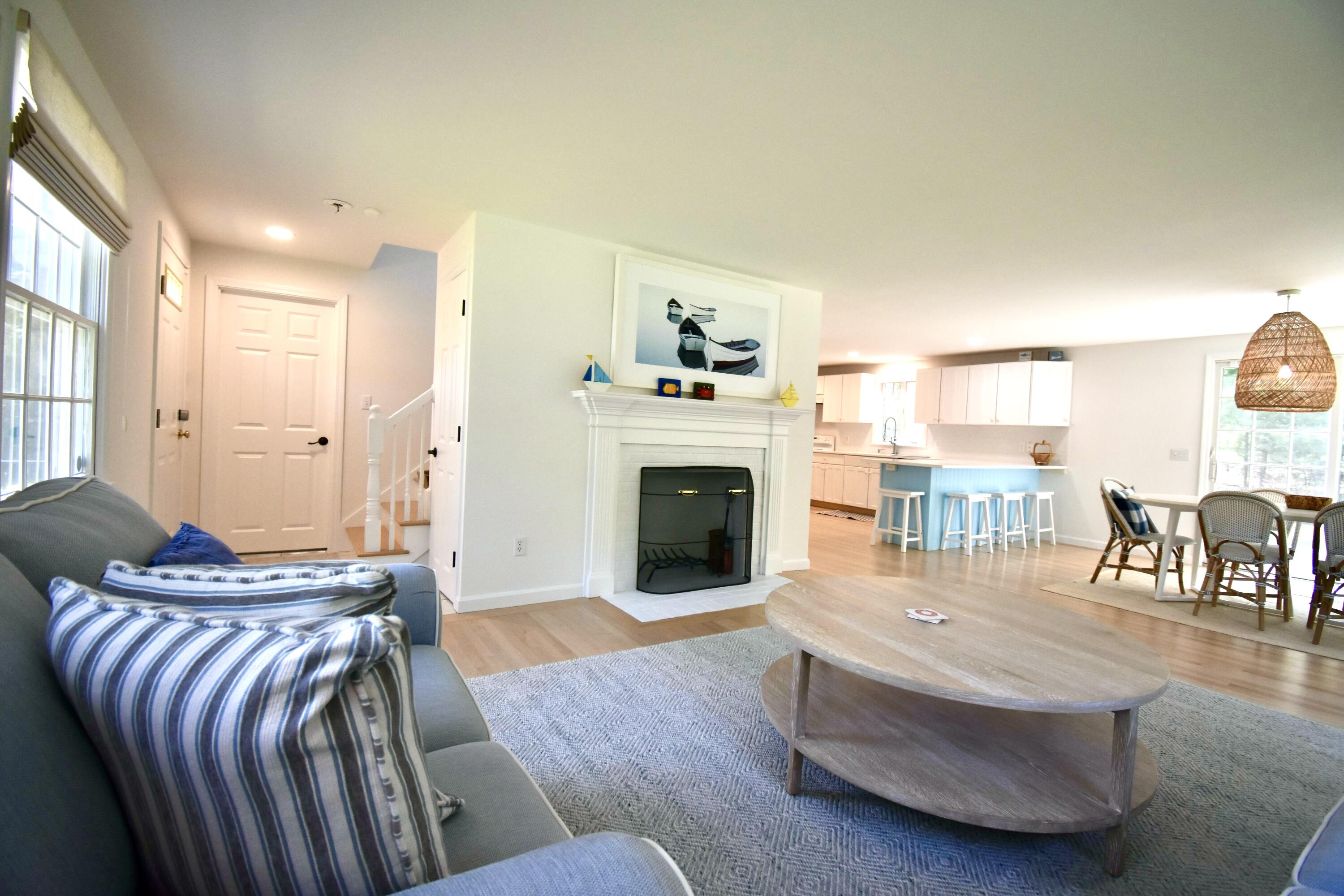 41 Turning Mill Road Brewster, MA 02631 - Photo 6 of 44 a living room with furniture and a fireplace