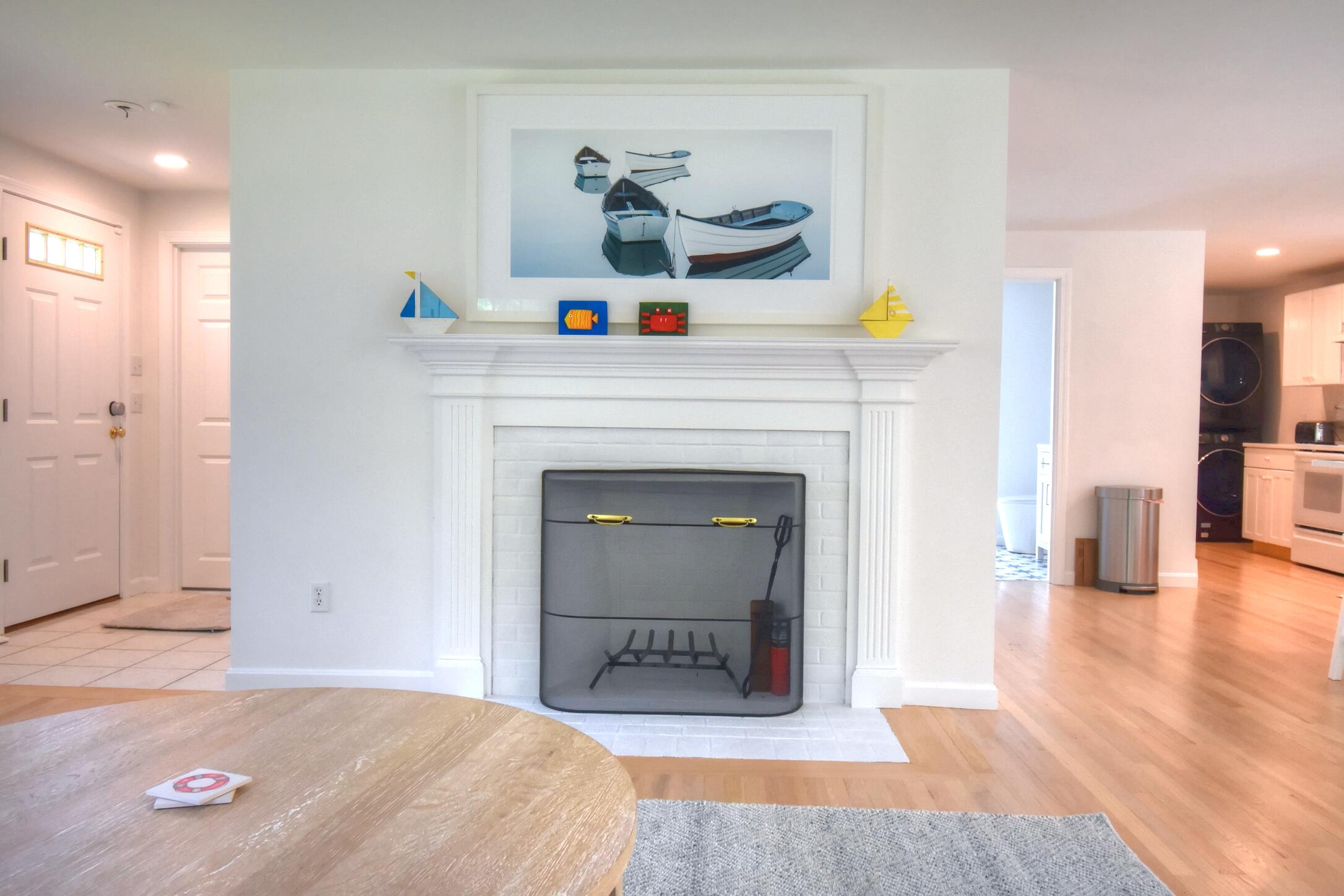 41 Turning Mill Road Brewster, MA 02631 - Photo 7 of 44 a living room with furniture and a fireplace