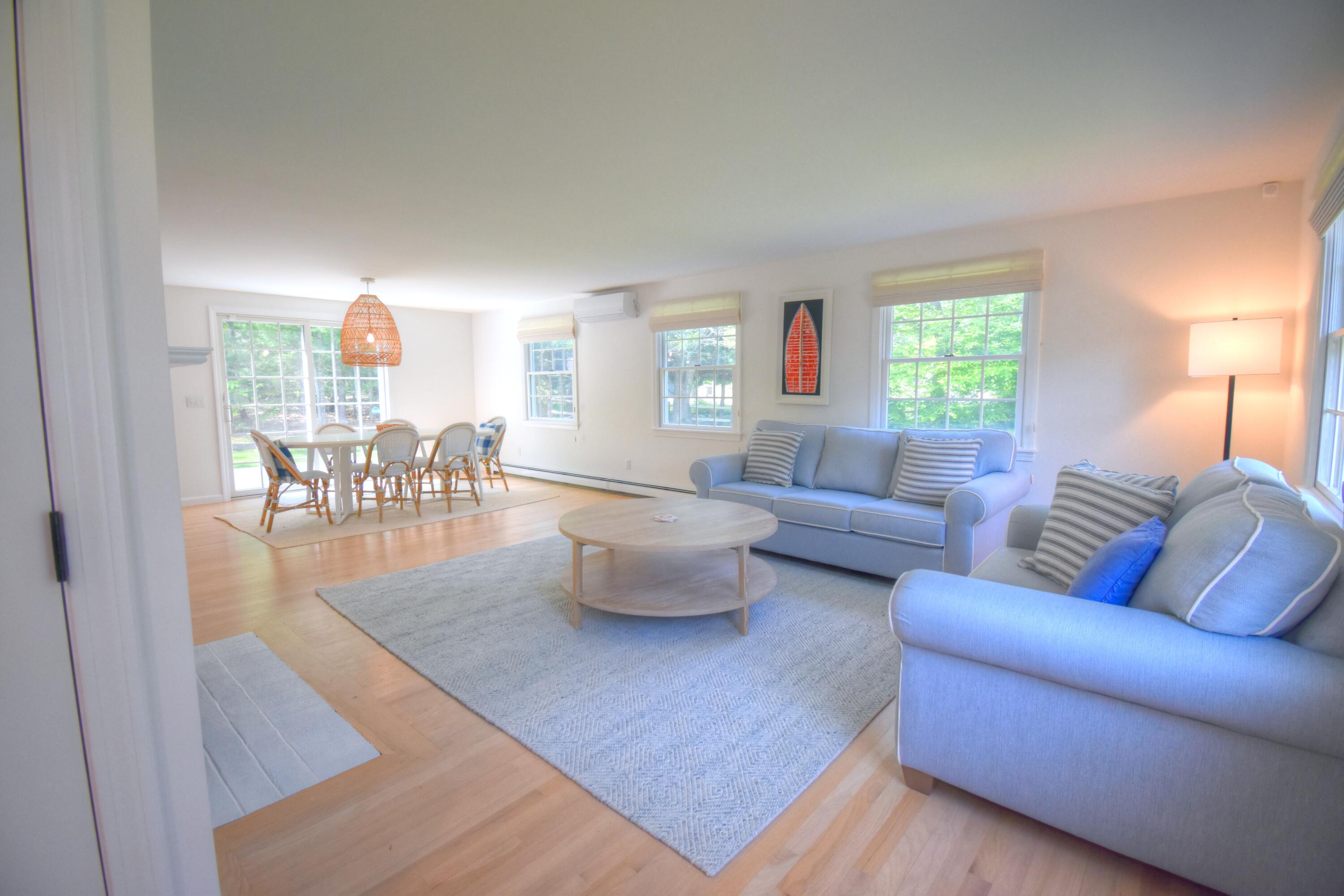 41 Turning Mill Road Brewster, MA 02631 - Photo 8 of 44 a living room with furniture and a table