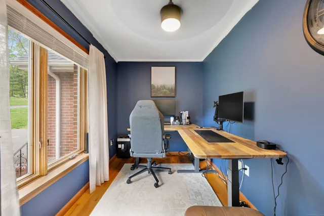 a room with furniture pool table and windows