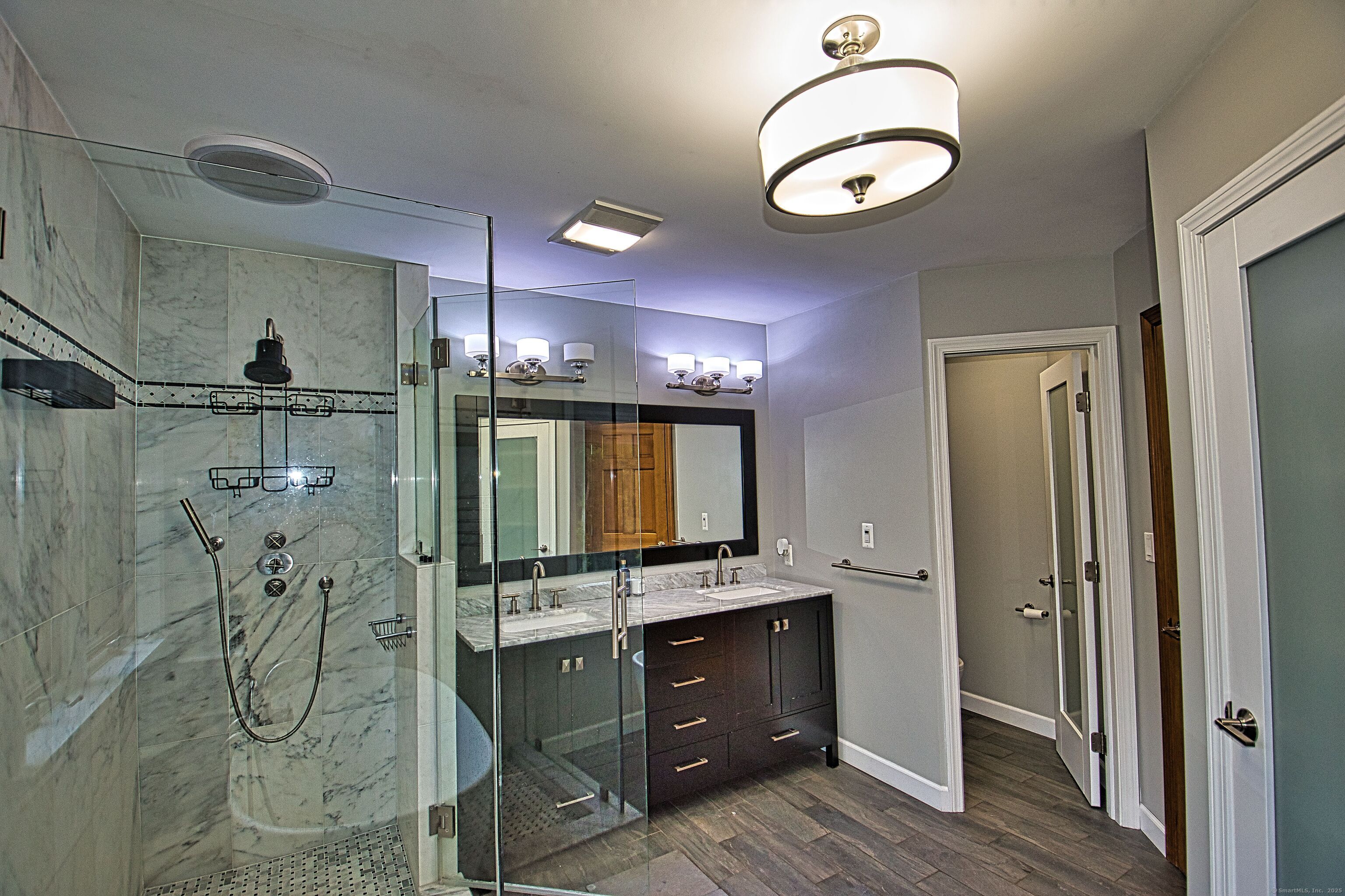 60 Wildcat Road Burlington, CT 06013 - Photo 23 of 39 a bathroom with a mirror and a sink