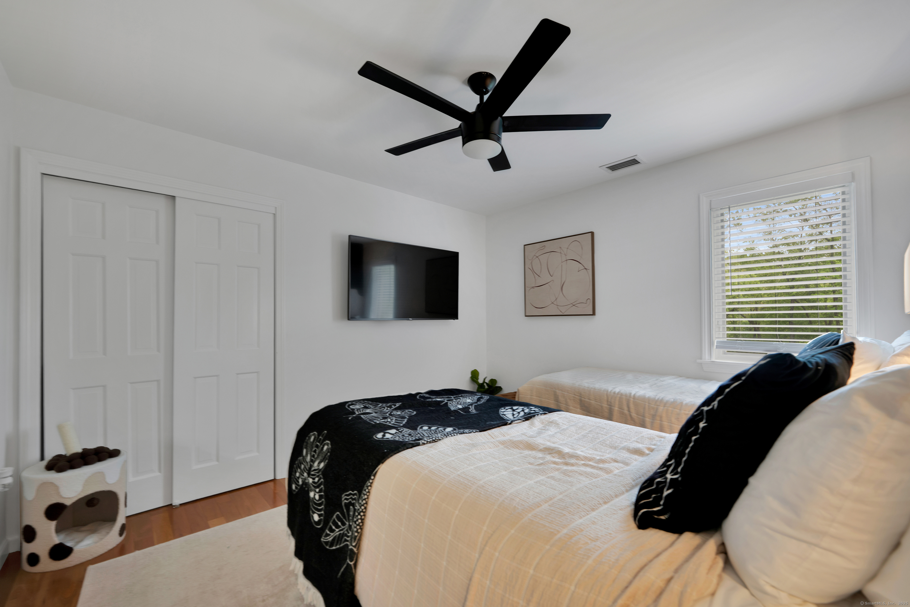 60 Wildcat Road Burlington, CT 06013 - Photo 25 of 39 a bedroom with a bed and a chandelier