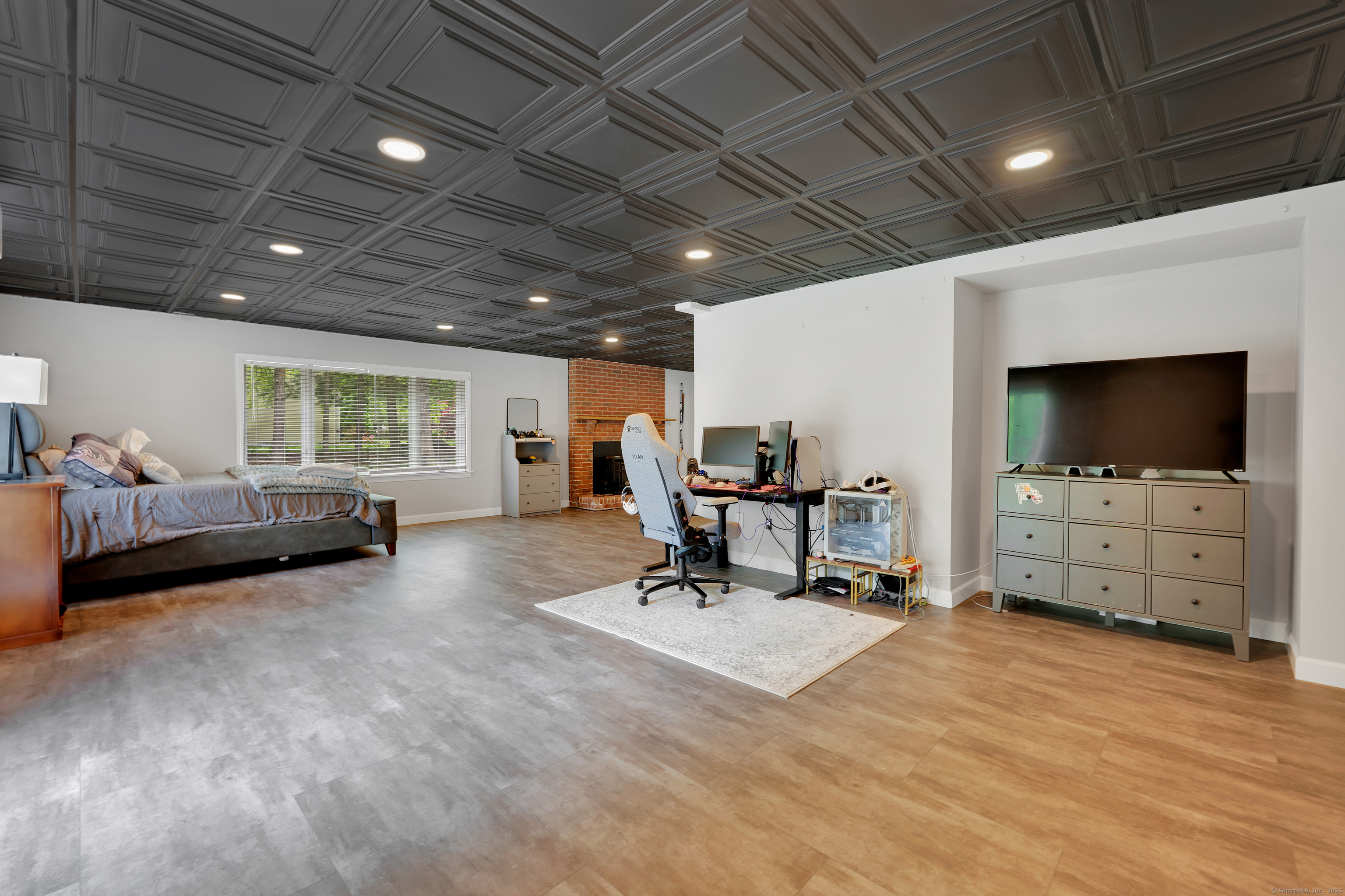 60 Wildcat Road Burlington, CT 06013 - Photo 30 of 39 a view of a livingroom with furniture and a flat screen tv