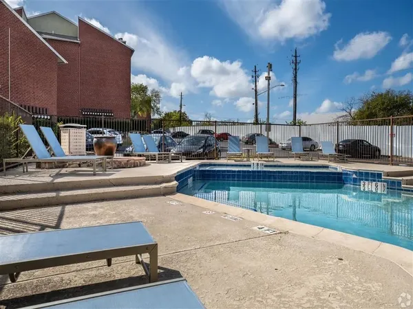 a view of swimming pool with outdoor seating