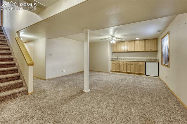 2135 Springcrest Road Colorado Springs, CO 80920 - Photo 12 of 48 Finished basement with wet bar and two additional bedrooms
