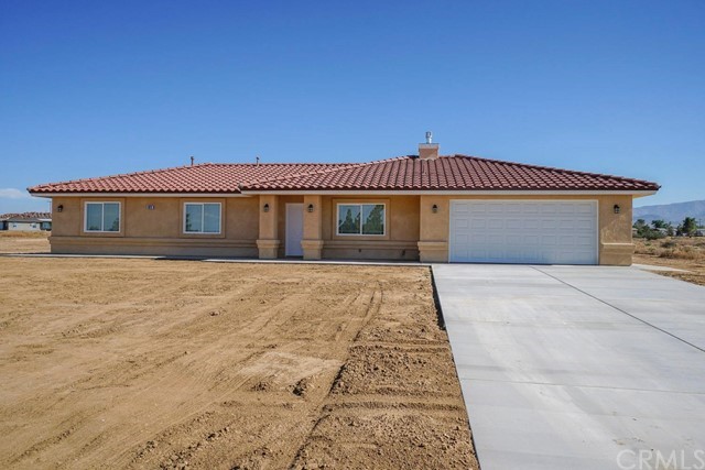 6629 Solano Road Phelan, CA 92371 - Photo 1 of 1 a front view of a house with a yard